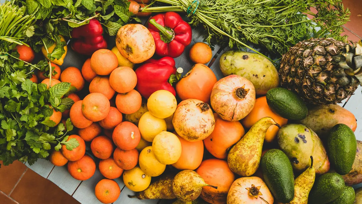 A colourful market display of fresh fruit and vegetables.